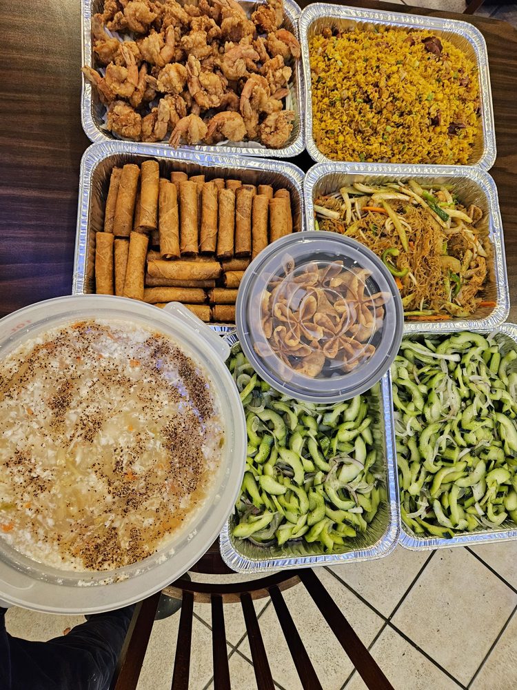 PhoWok Oak Hill Austin catering tray with fried shrimp, fried rice, spring rolls, congee and cucumber salad