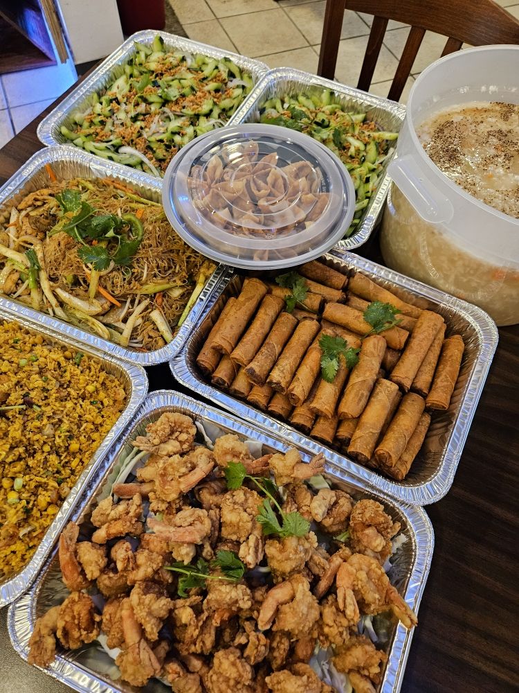 PhoWok Austin catering trays of noodles, fried rice, spring rolls and fried shrimp for parties