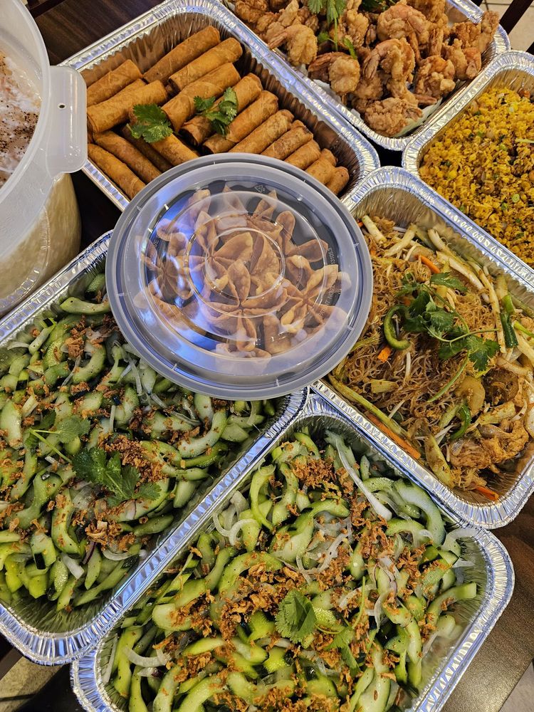 PhoWok Austin 78735 family-style catering trays with spring rolls, fried shrimp, noodles and cucumber salad
